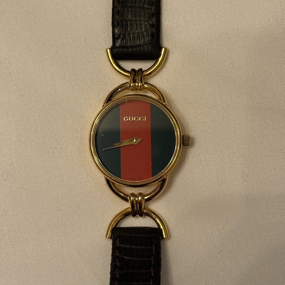 Verified Gucci Gold and Black Leather Watch